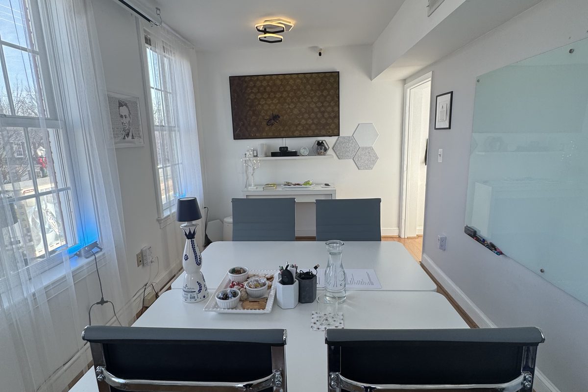 A bright, thoughtfully arranged meeting room at The Hive ready for a planning session