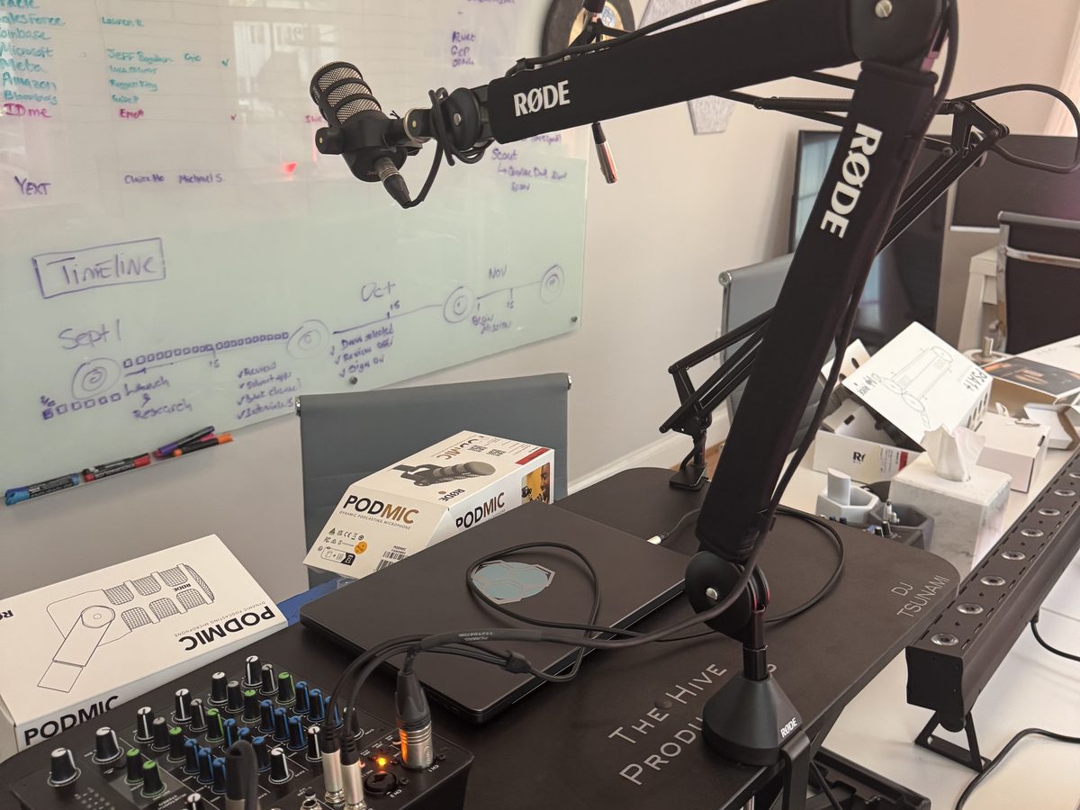 The Hive's podcast studio with a professional RODE microphone and mixing console